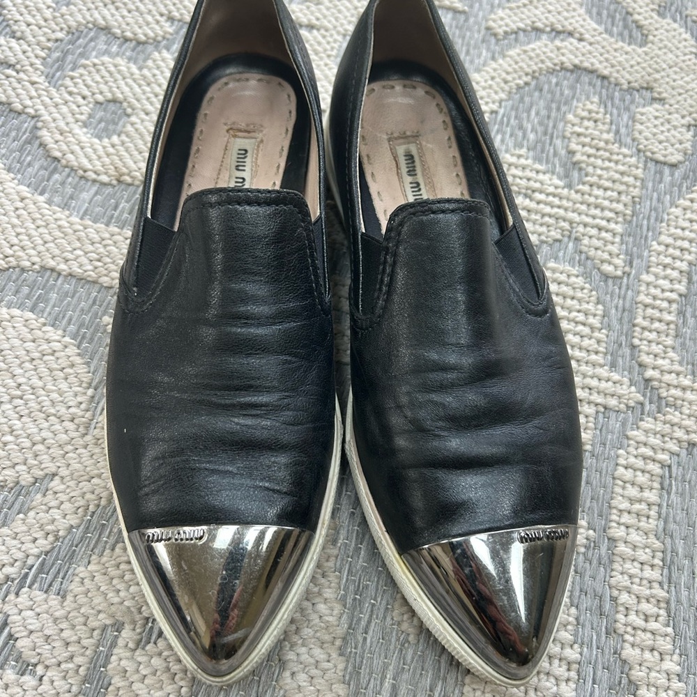 Miu Miu Black Leather Loafers with Silver Toe Caps